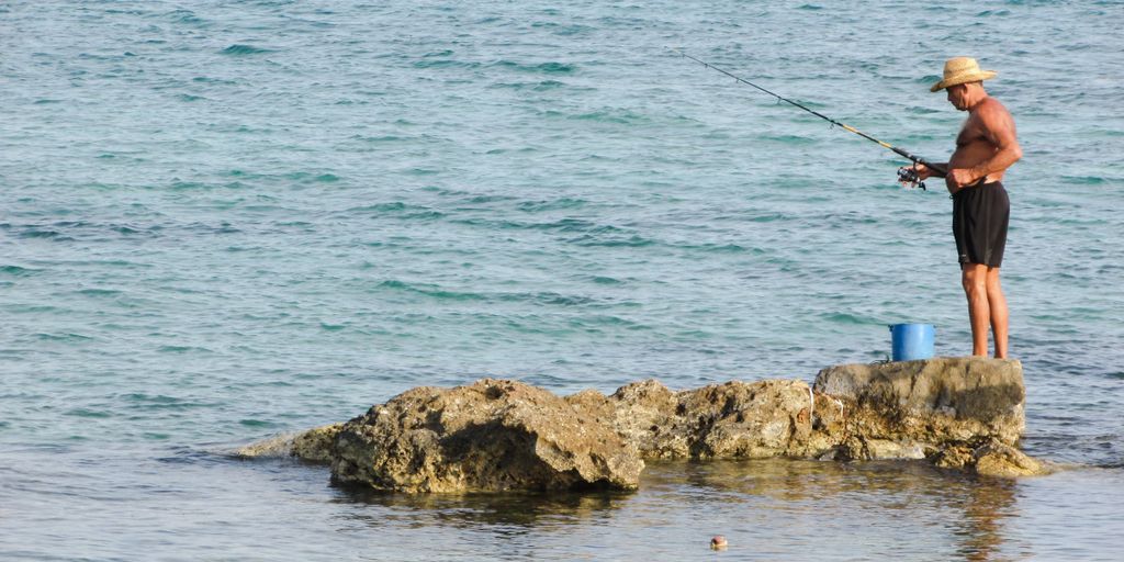 fisherman using tuna lure in ocean